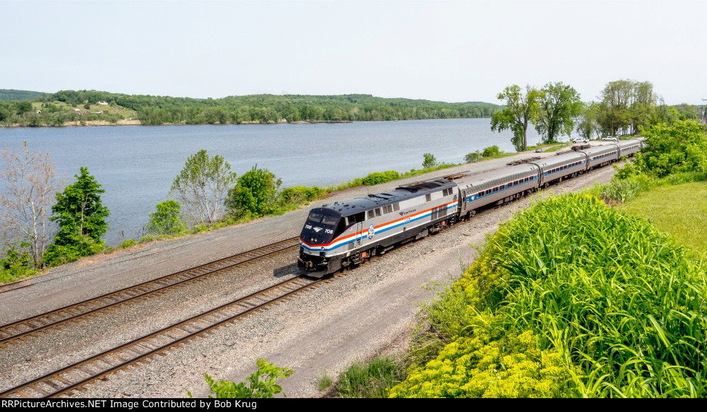 AMTK 708 leads NYC-bound Empire Service train through Stuyvesant, NY along the Hudson River